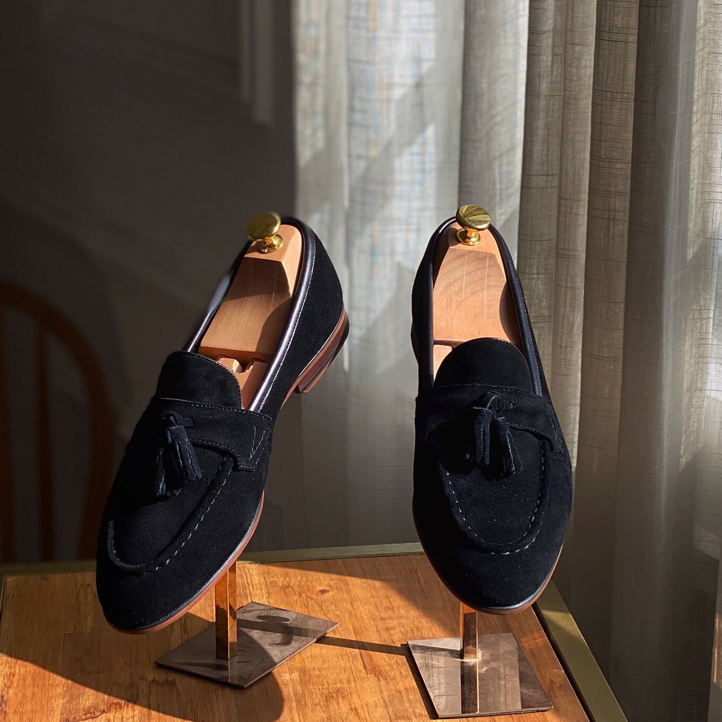 black suede tassel loafers